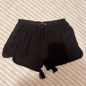 Black soft drawstring shorts with criss cross detail